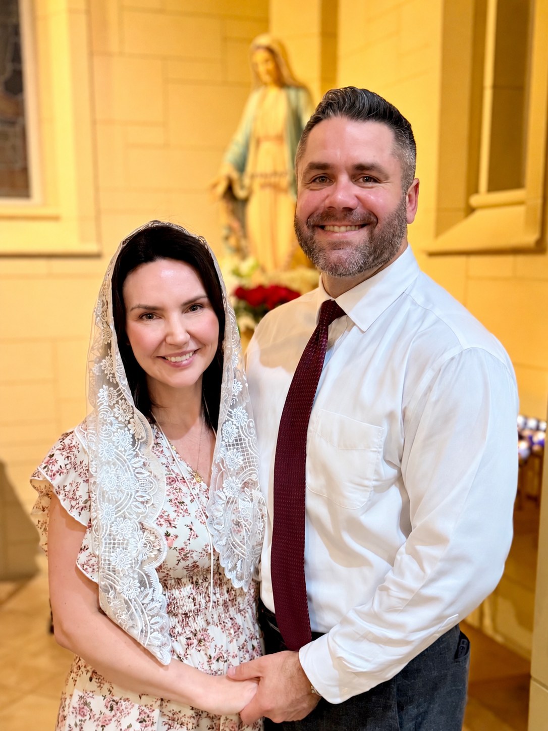 Sacred Thread Rosary Co. founder with her husband at her Catholic confirmation